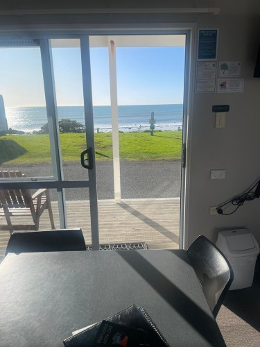 4 berth - view of ocean from dining table through sliding doors - WhatsApp Image 2023 08 03 at 4.43.52 PM